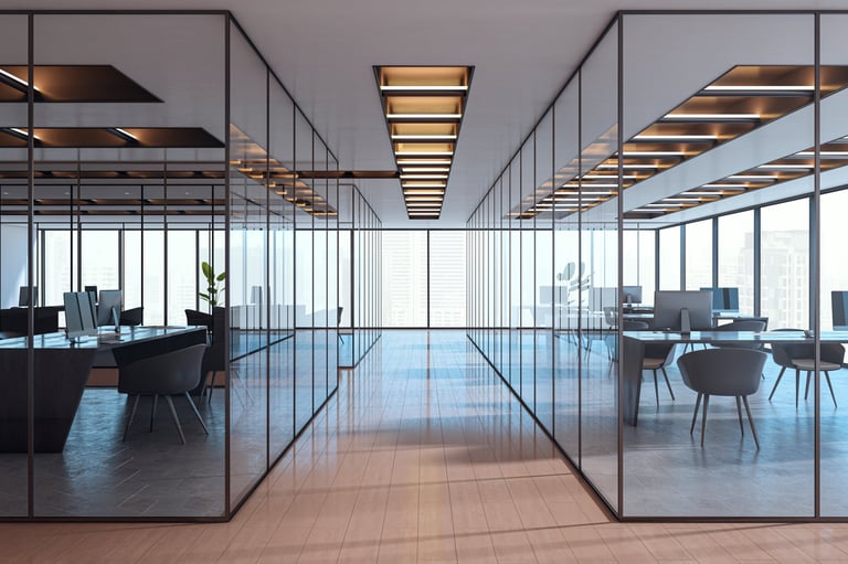 Contemporary corporate office interior with glass partitions and city view